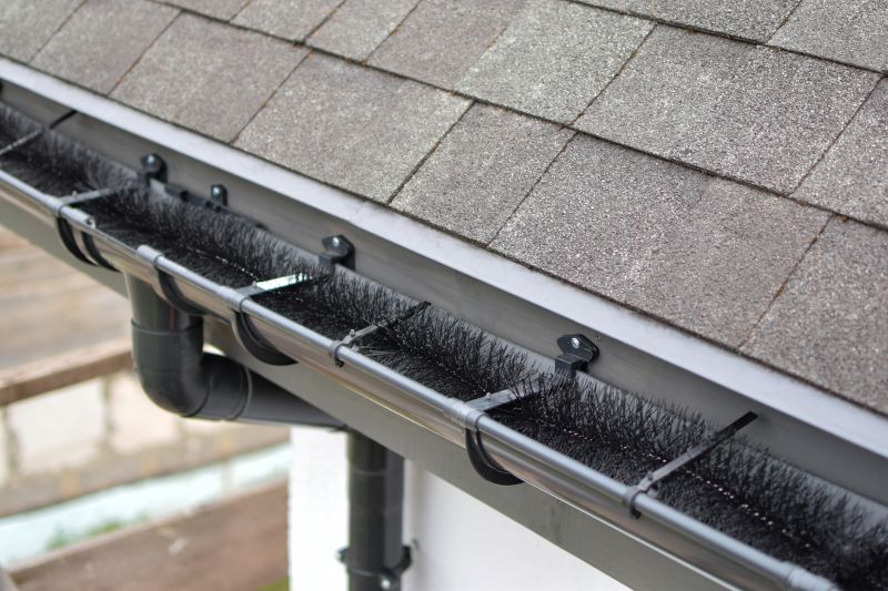 Gutter system with leaf guards